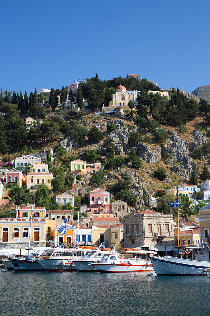 Boats moored in the marina at Gialos Harbor, Symi (Simi) Island; Dodecanese Island Group, Greece