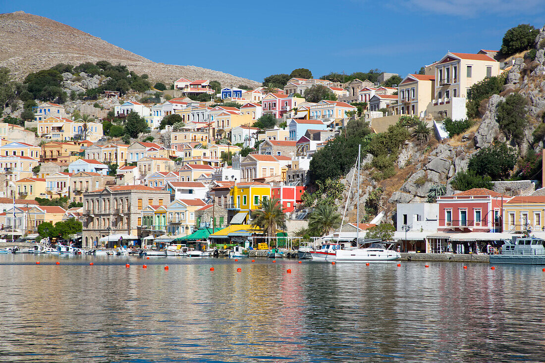 Sunny day on the waterfront at Gialos Harbor, Symi (Simi) Island; Dodecanese Island Group, Greece
