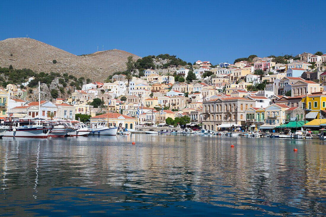 Sunny Day on the waterfront at Gialos Harbor, Symi (Simi) Island; Dodecanese Island Group, Greece