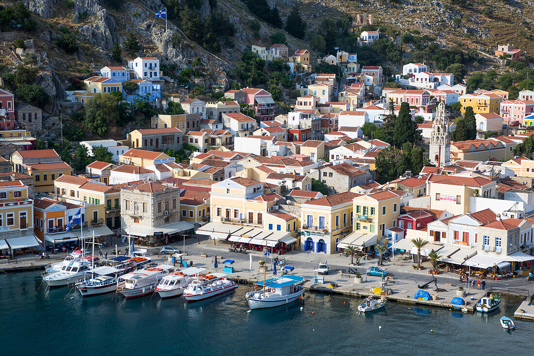 Overview of boats moored along the shore at Gialos Harbor, Symi (Simi) Island; Dodecanese Island Group, Greece