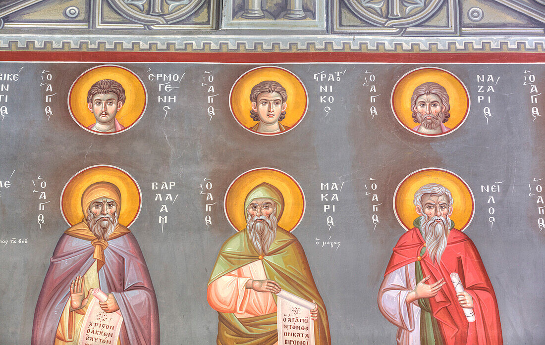 Close-up of colorful religious fresco of three saints inside the Holy Church of St Nicholas in Koukaki; Athens, Greece