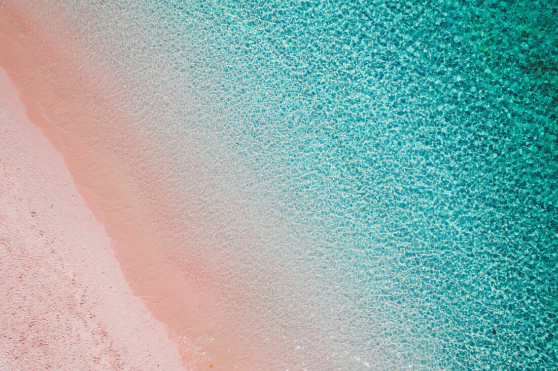 View taken directly above of a pink sand beach along the shore of Padar Island in Komodo National Park; East Nusa Tenggara, Lesser Sunda Islands, Indonesia