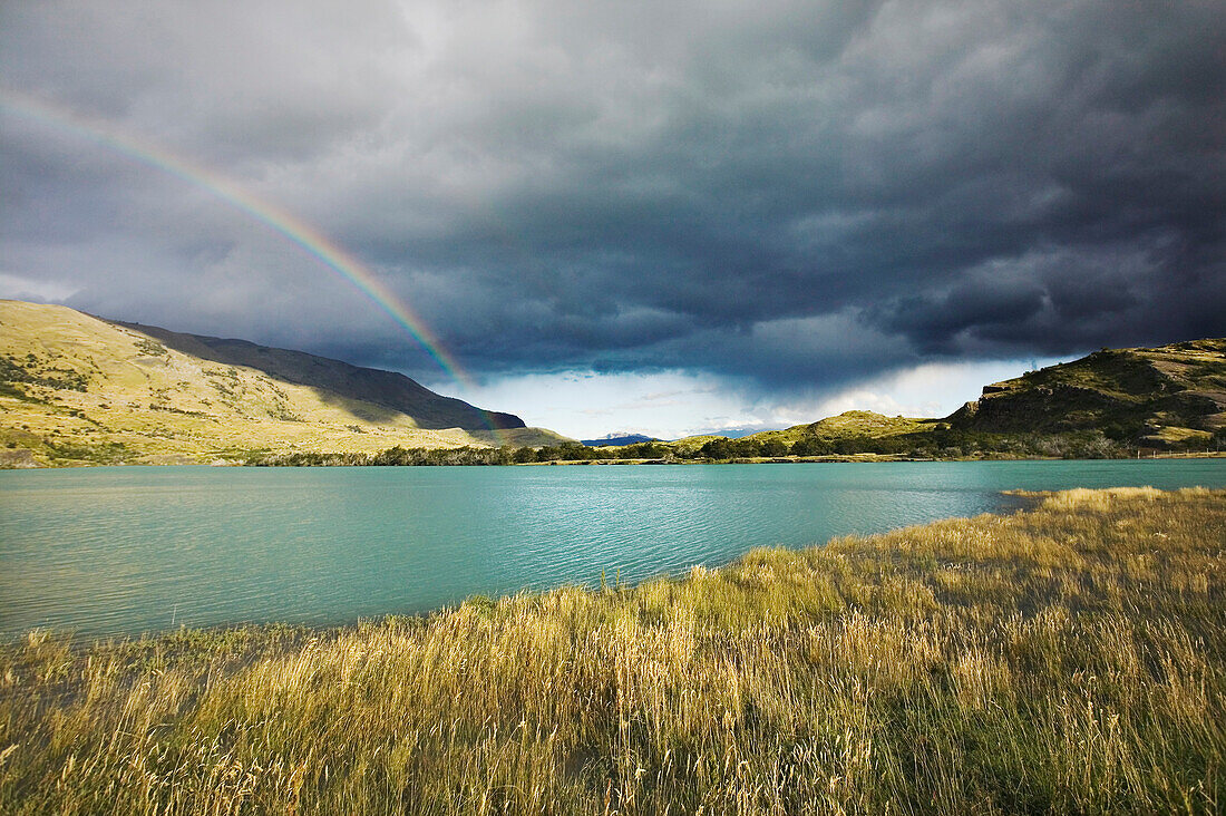 A rainbow in Torres del Paine National Park, Patagonia, Chile.; Lago Toro, Torres del Paine National Park, Patagonia, Chile.