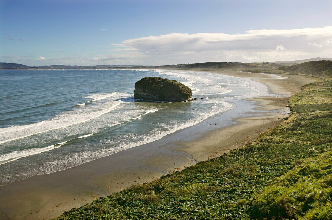 A deserted sandy bay open to Pacific surf, Patagonia, Chile.; Chiloe, in Patagonia, Chile.