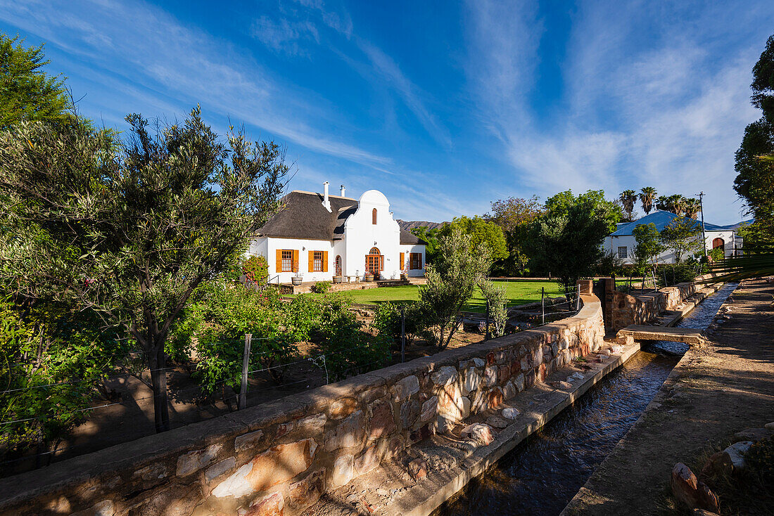 Traditional Cape Dutch architecture and the water channels from the the Lei Water System that provide water to the town of Prince Albert from the Swartberg Mountains; Western Cape, South Africa
