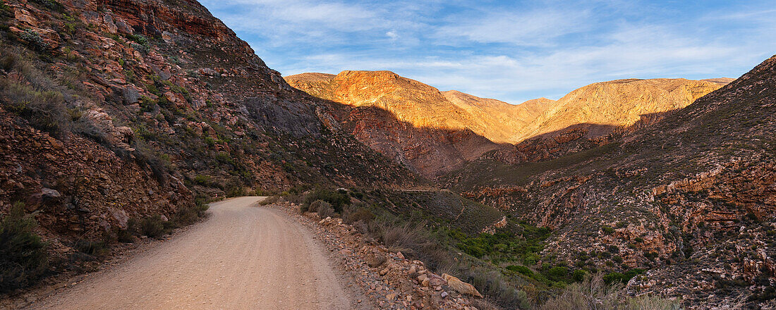 Road from Prince Albert into the mountain cliffs along the Swartberg Pass; Western Cape, South Africa