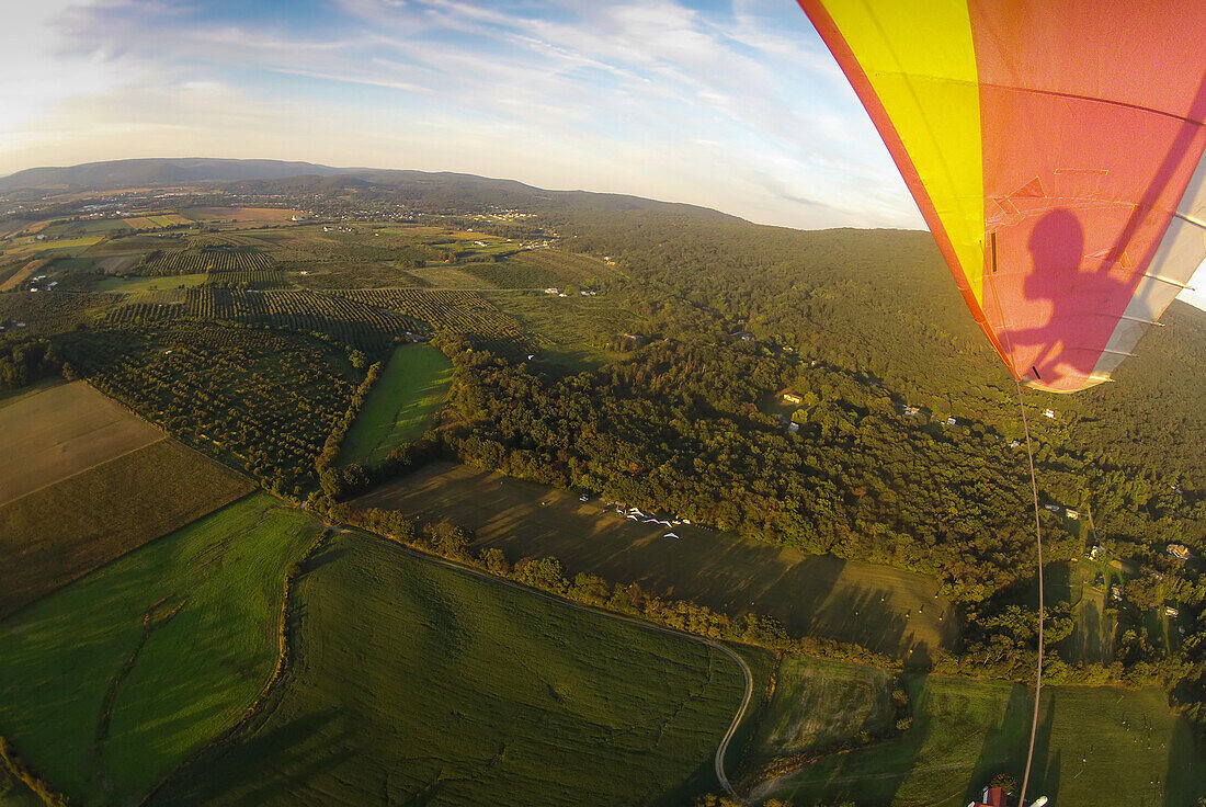 Hang gliding over the landing field near High Rock in the Cumberland Valley.; Cumberland Valley, Maryland.