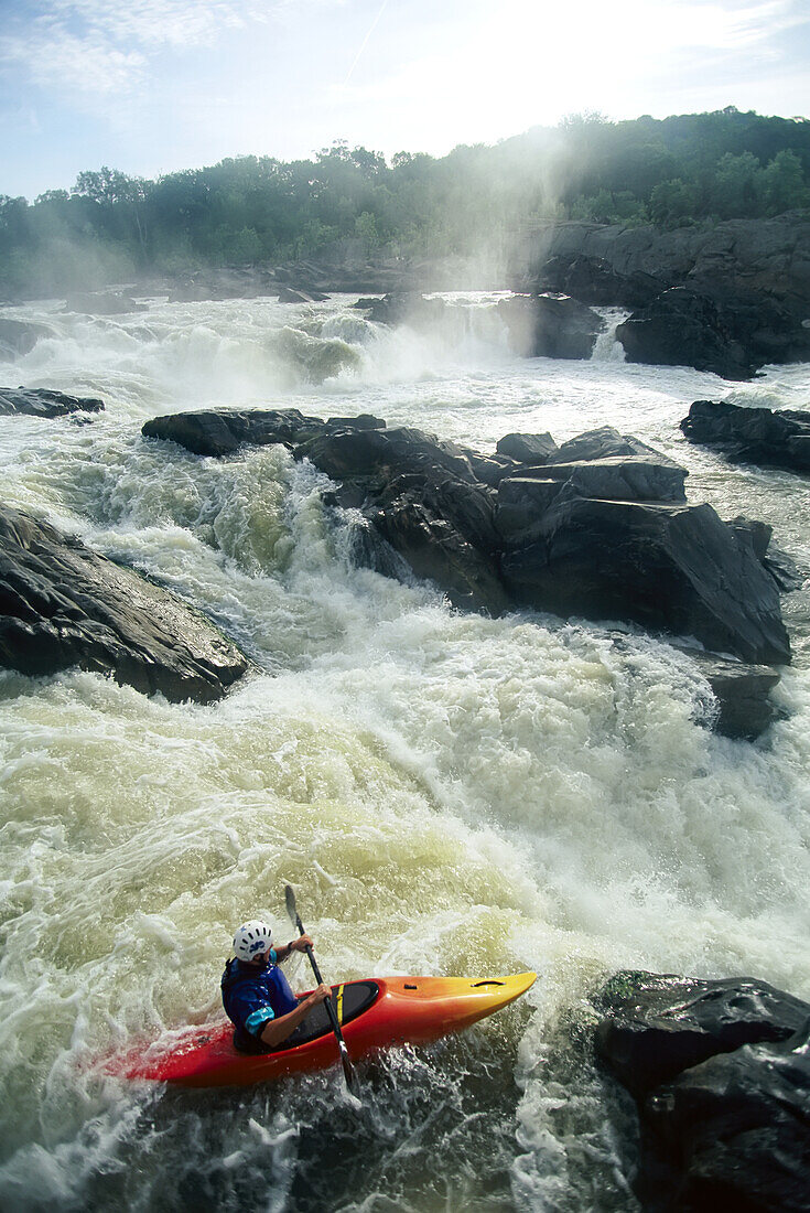 Kayaker running Maryland side of Great Falls on the Potomac River.; GREAT FALLS, POTOMAC RIVER, MARYLAND.