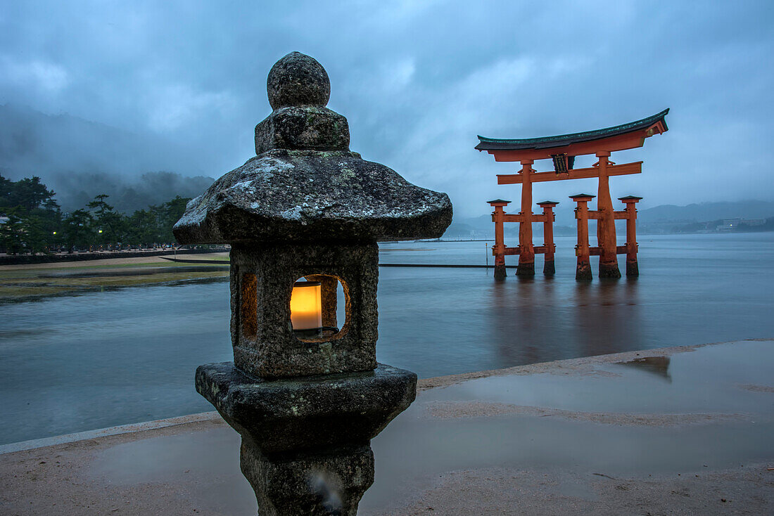 Lantern lit on an evening at Miyajima. Officially named Itsukushima, it is a small island less than an hour outside the city of Hiroshima. It is most famous for its giant torii gate, which at high tide seems to float on the water. The sight is ranked as one of Japan's best views; Hiroshima, Japan