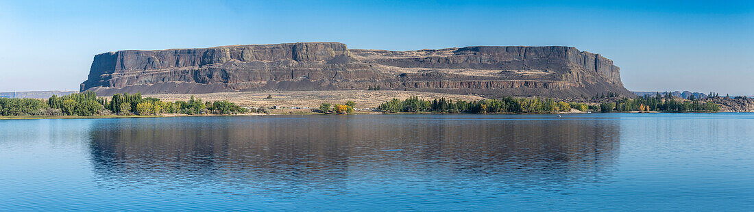 Steamboat Rock at Steamboat Rock State Park as seen from across Devils Punch Bowl, part of the Banks Lake in Eastern Washington; Hartline, Washington, United States of America