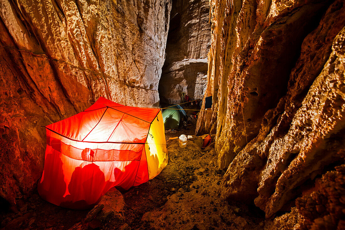 An expedition team camps inside Dark Star, a limestone cave system in Uzbekistan's Boysuntov Range.; Uzbekistan.