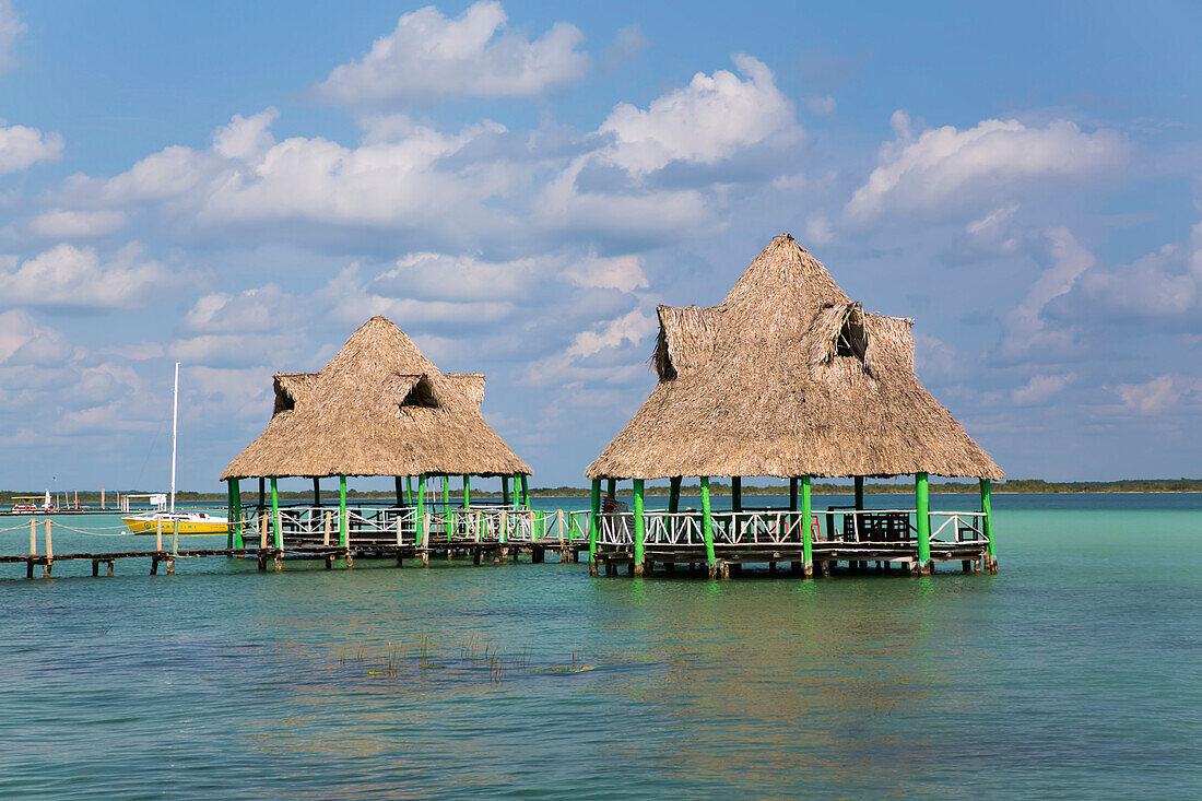 Tiki hut gazebos on the dock, on the Lagoon in Bacalar; Quintana Roo, Mexico