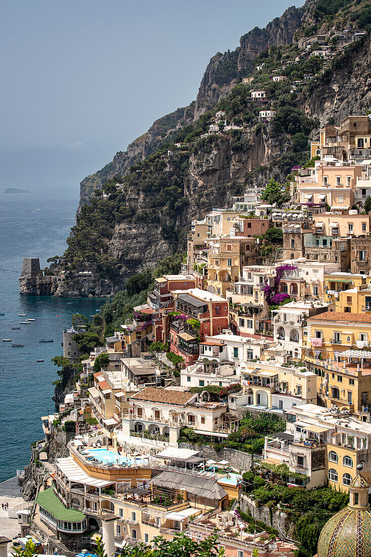 Stone buildings and terraces on the cliffside in the town of Positano along the Amalfi Coast; Positano, Salerno, Italy