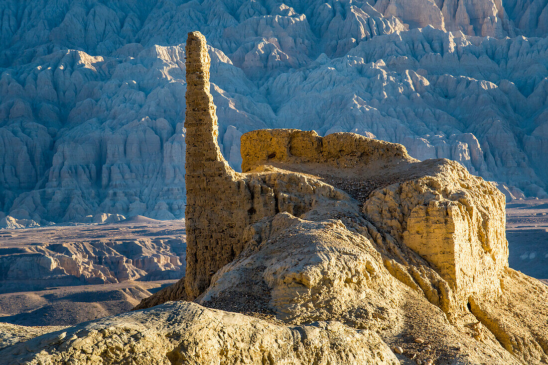 Ruins and limestone rock formations in the mountainous landscape around the Sutlej Valley near the Guge Kingdom with Himalayas in background; Tsaparang, Zanda, Tibetan Autonomous Region, Tibet