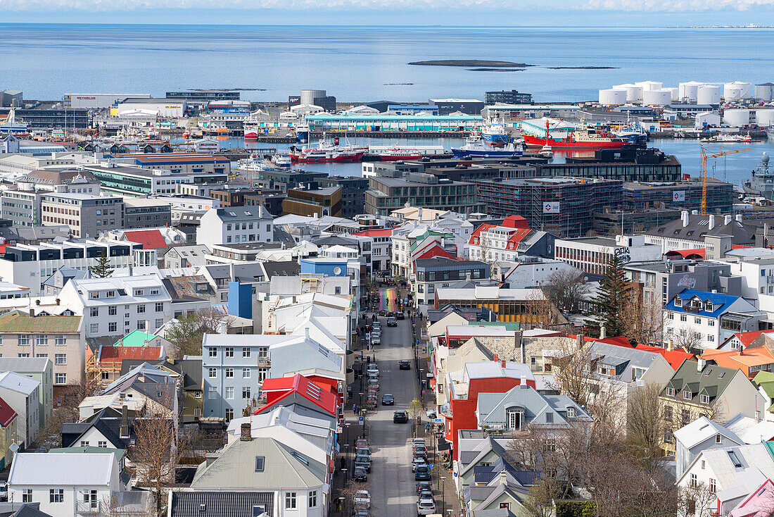An aerial view of downtown Reykjavík with houses, industrial buildings and harbor, as seen from the top of the church. The brightly colored houses create a beautiful effect; Reykjavík Iceland