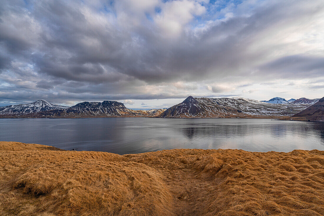 The landscape of the Strandir Coast in the West Fjords of Iceland glow in the setting sun. An area of extreme wilderness and peace; Djupavik, West Fjords, Iceland