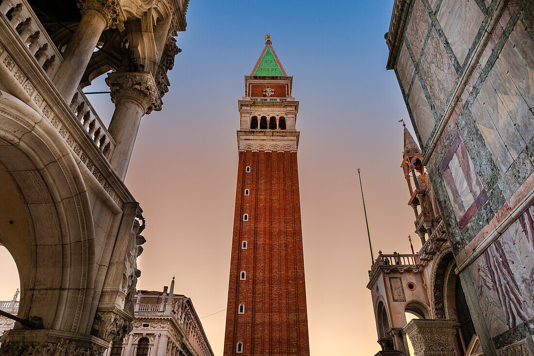 View of St Mark's Campanile and Doge's Palace in Piazza San Marco at twilight; Veneto, Venice, Italy