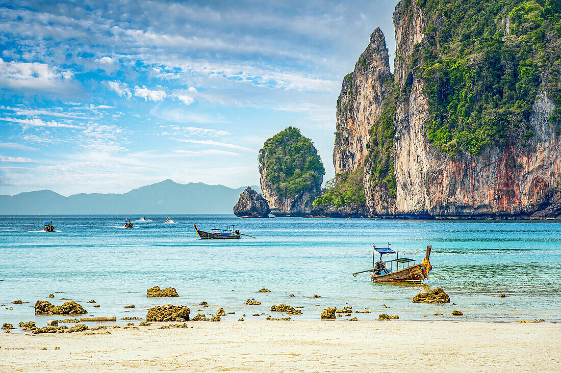 Longtail boats and shoreline scene at Koh Phi Phi, Thailand; Koh Phi Phi, Thailand