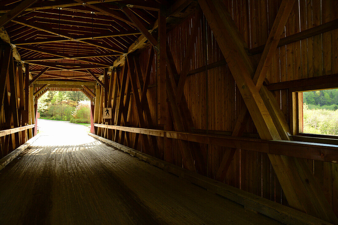 View from the inside of the Point Wolfe covered bridge in Fundy National Park.; Alma, Fundy National Park, New Brunswick, Canada.