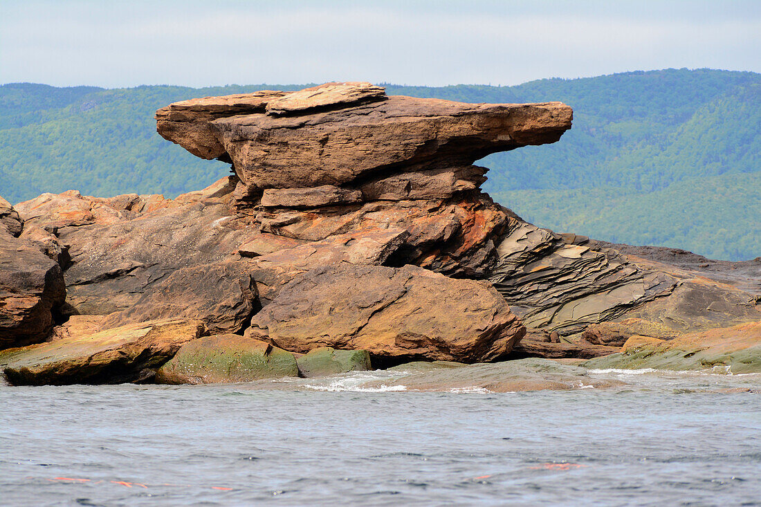 An anvil-shaped rock on the coast of Bird Island.; Bird Island, Cape Breton, Nova Scotia, Canada.