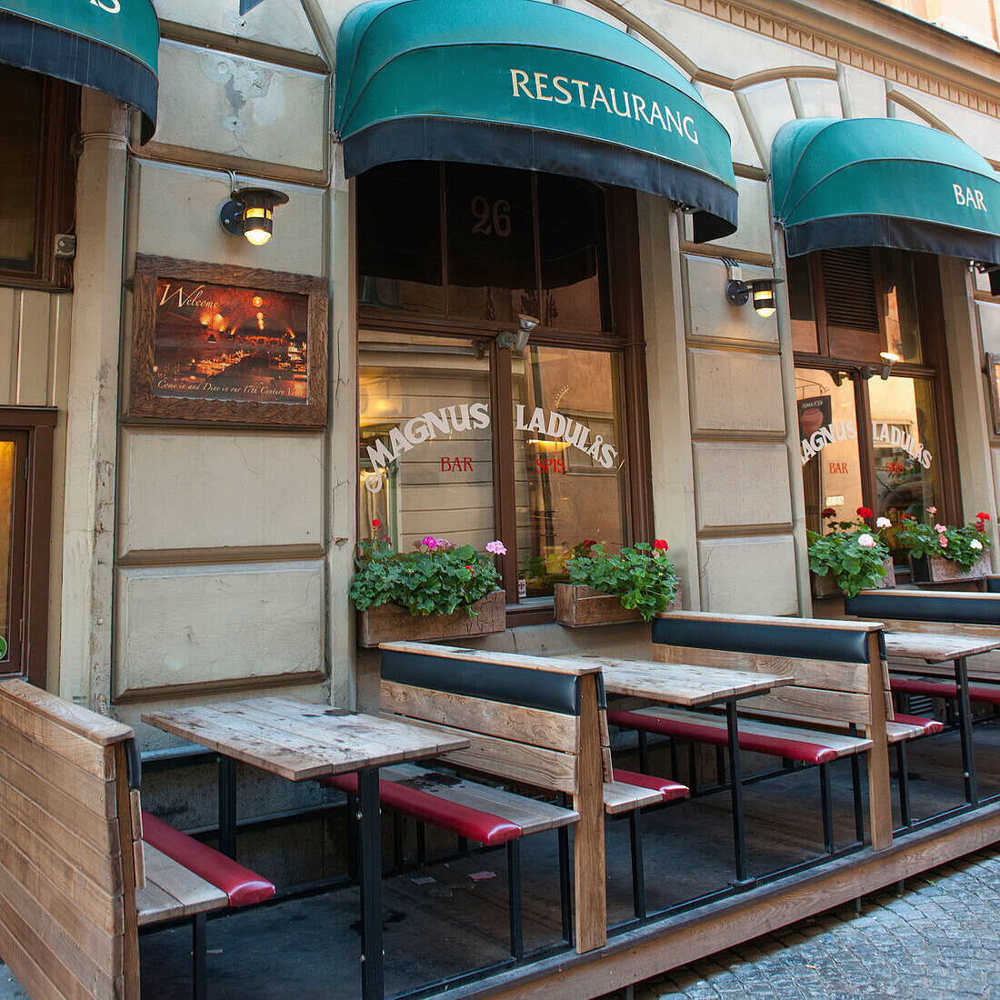 Tables And Benches On An Outdoor Restaurant Patio; Stockholm Sweden
