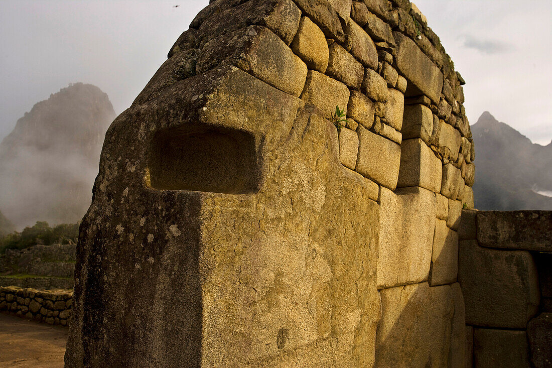 Walls of Machu Picchu and clouds; Machu Picchu, Peru