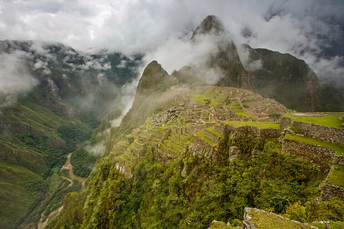 Cloud shrouded Machu Picchu; Machu Picchu, Peru