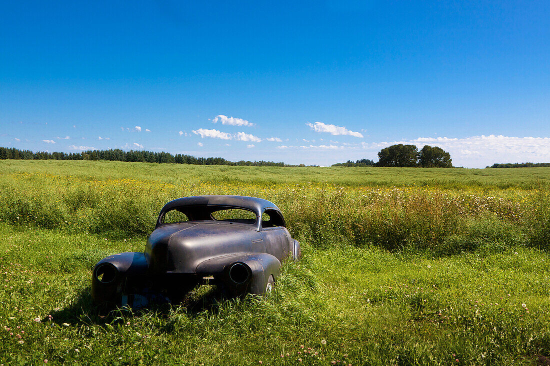 A Vintage Car Abandoned In A Field; Parkland County Alberta Canada