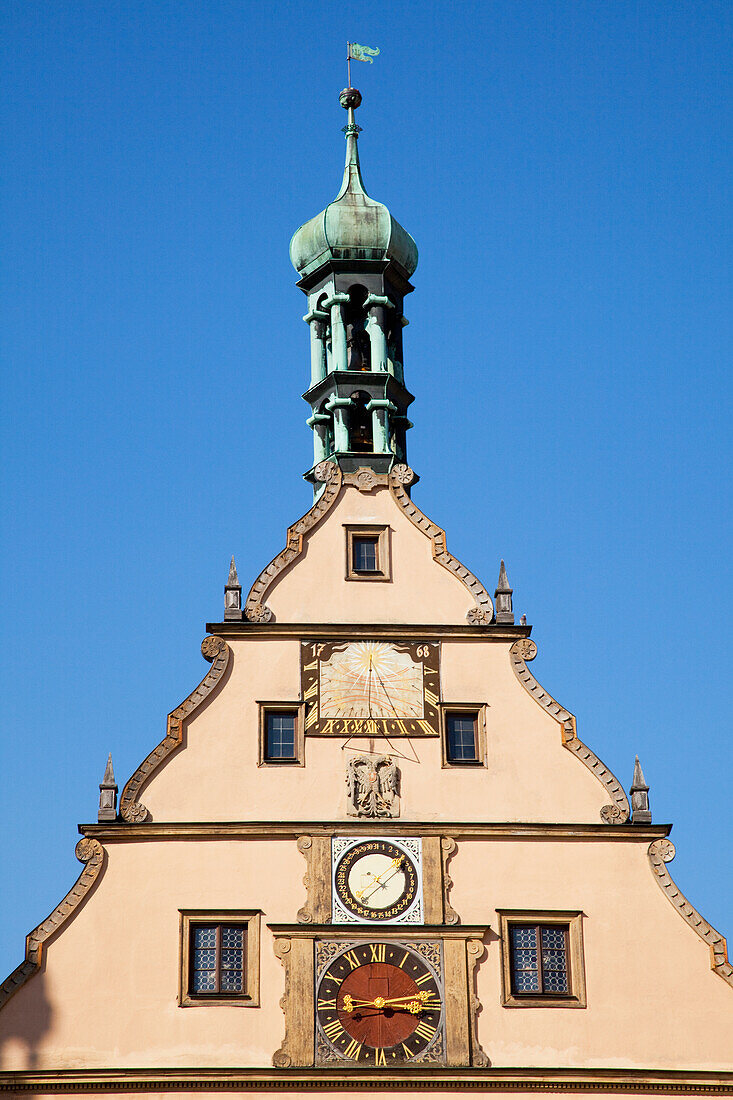 Peak Of A Building With A Clock Against A Blue Sky; Rothenburg Ob Der Tauber Bavaria Germany