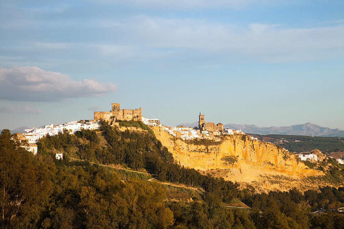 View Of The Town On A Hill With Mountains In The Background; Arcos De La Frontera Andalusia Spain