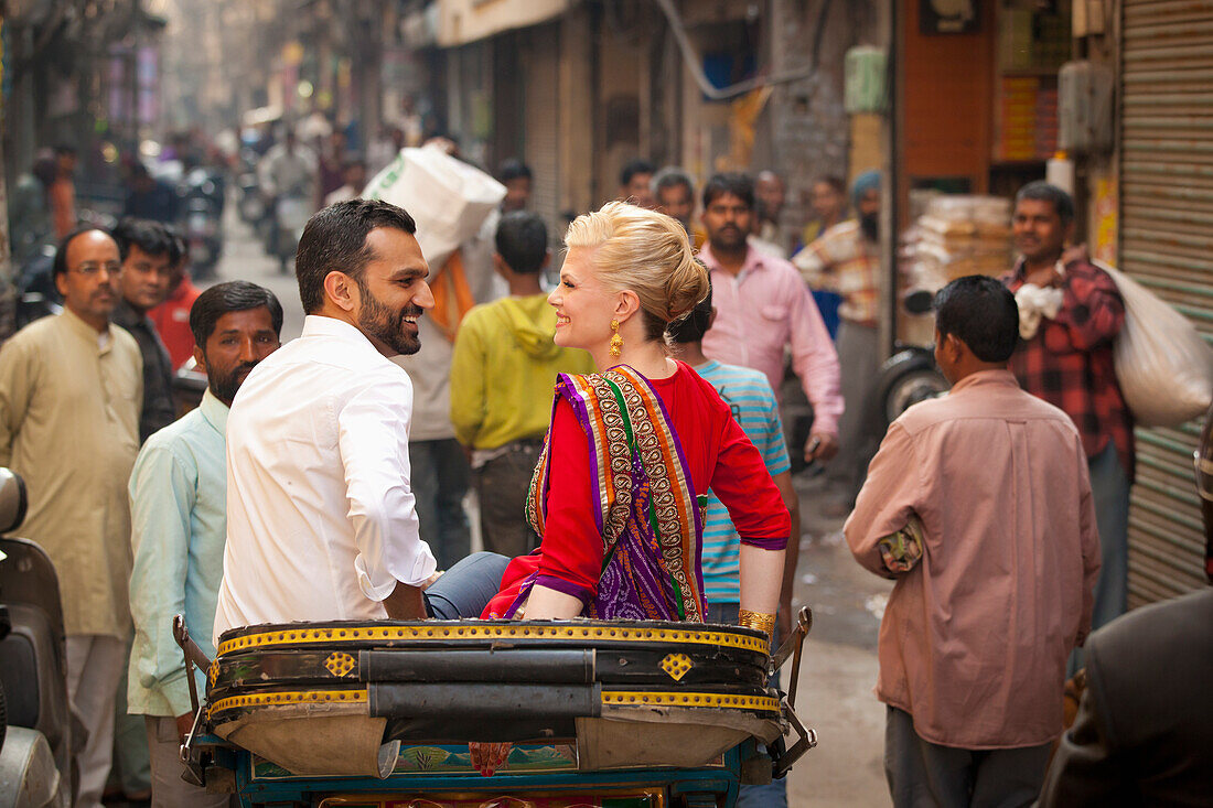 A Mixed Race Couple Riding In A Rickshaw; Ludhiana, Punjab, India