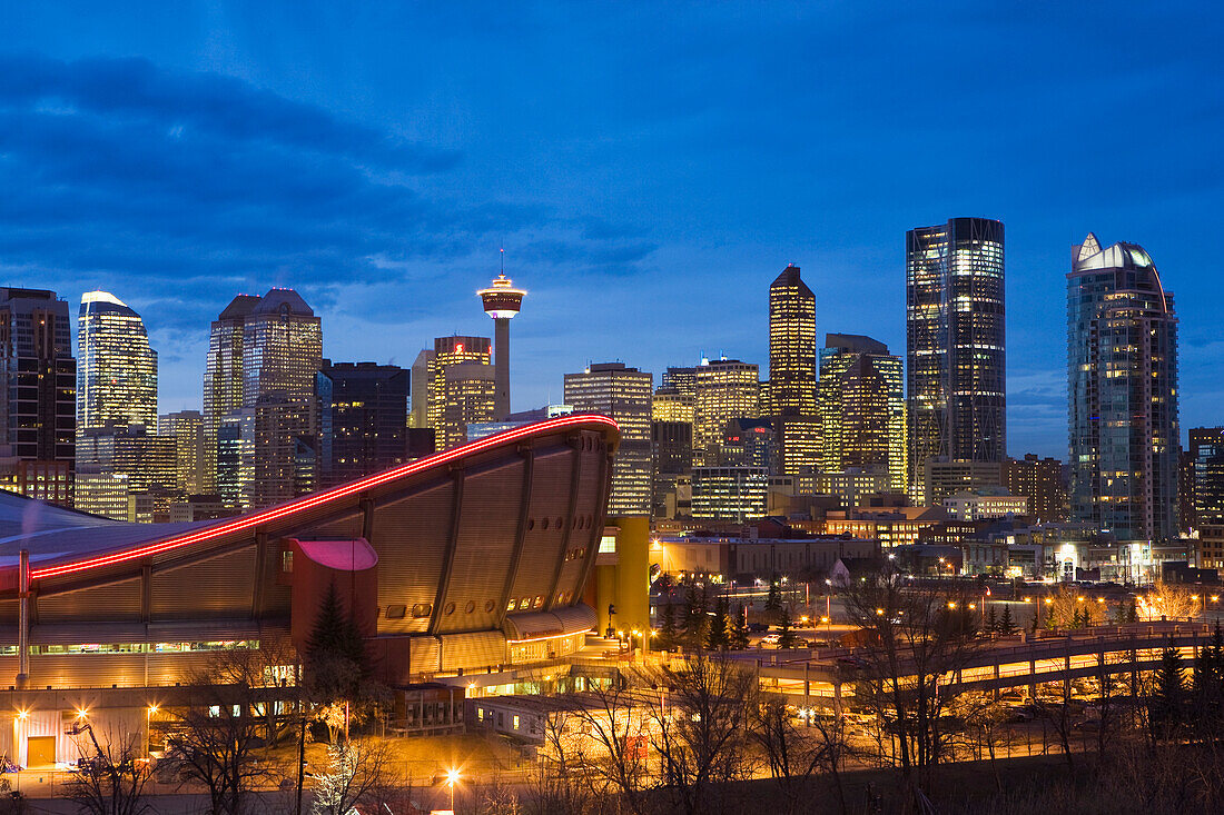 Calgary Skyline With Saddledome At Dusk With City Lights; Calgary Alberta Canada