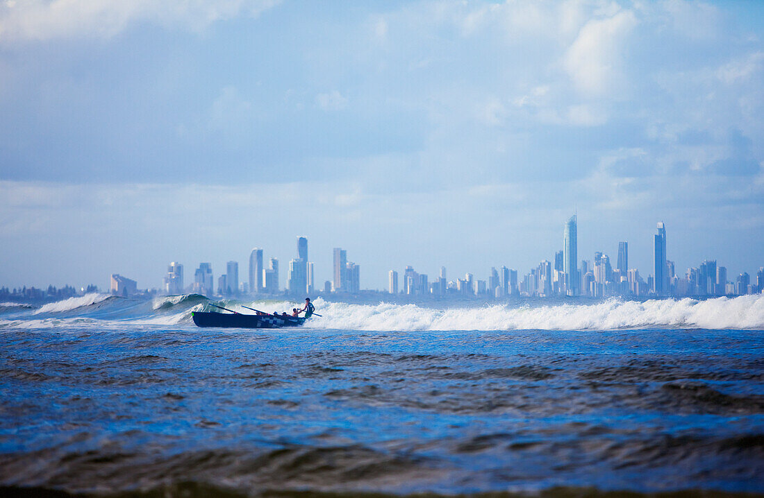 Rowing A Boat In A Large Wave At Surfer's Paradise; Gold Coast Queensland Australia