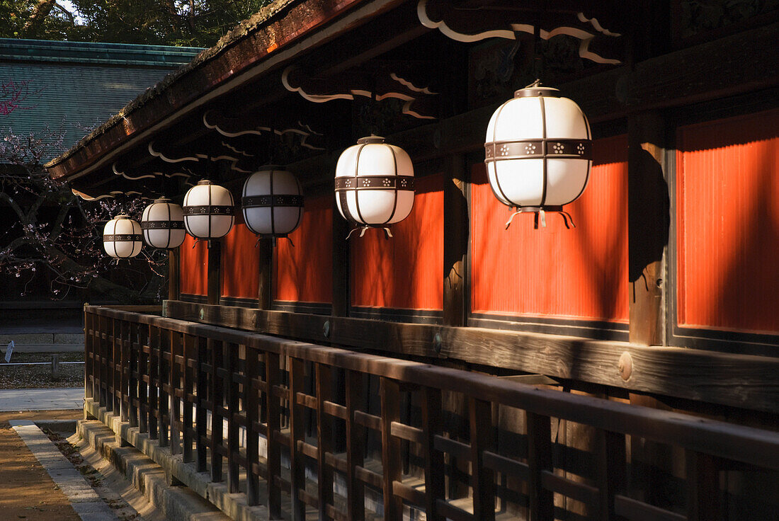 Japanese Temple Lanterns And Red Wall; Kyoto, Japan