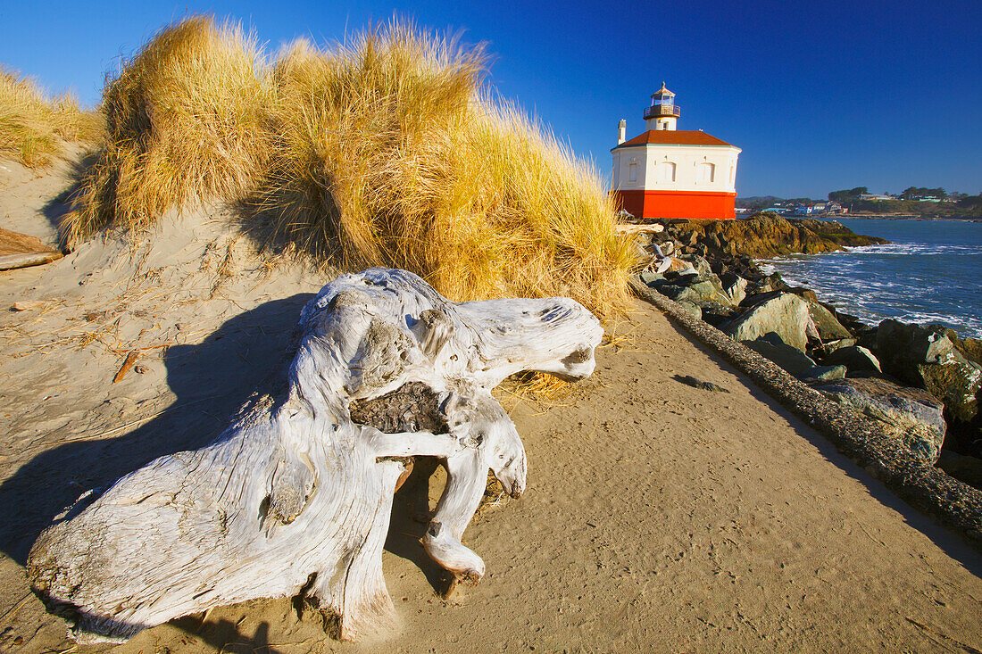 Coquille River Lighthouse And Bandon Beach; Oregon, United States Of America