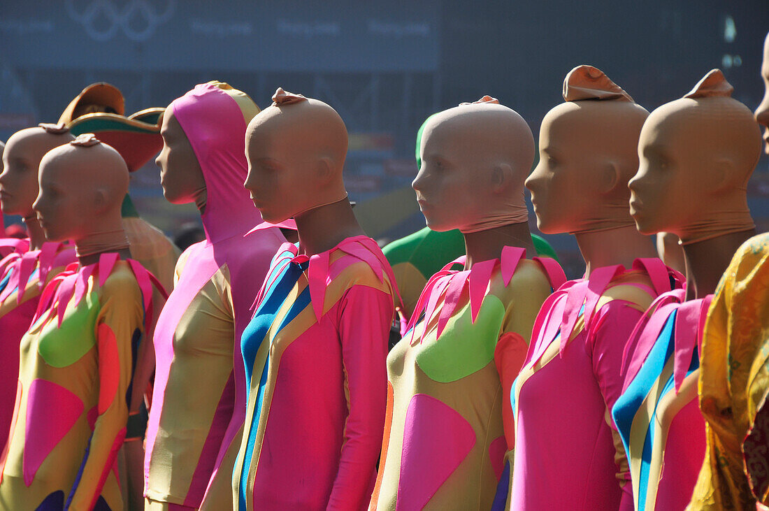 Models In A Row Wearing Bright Colourful Clothing; Beijing China
