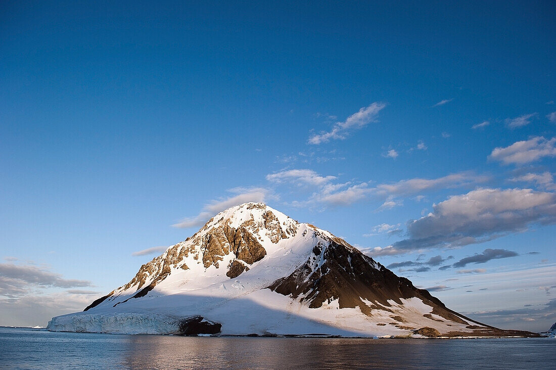 Snow Covered Mountain On The Coast; Antarctica