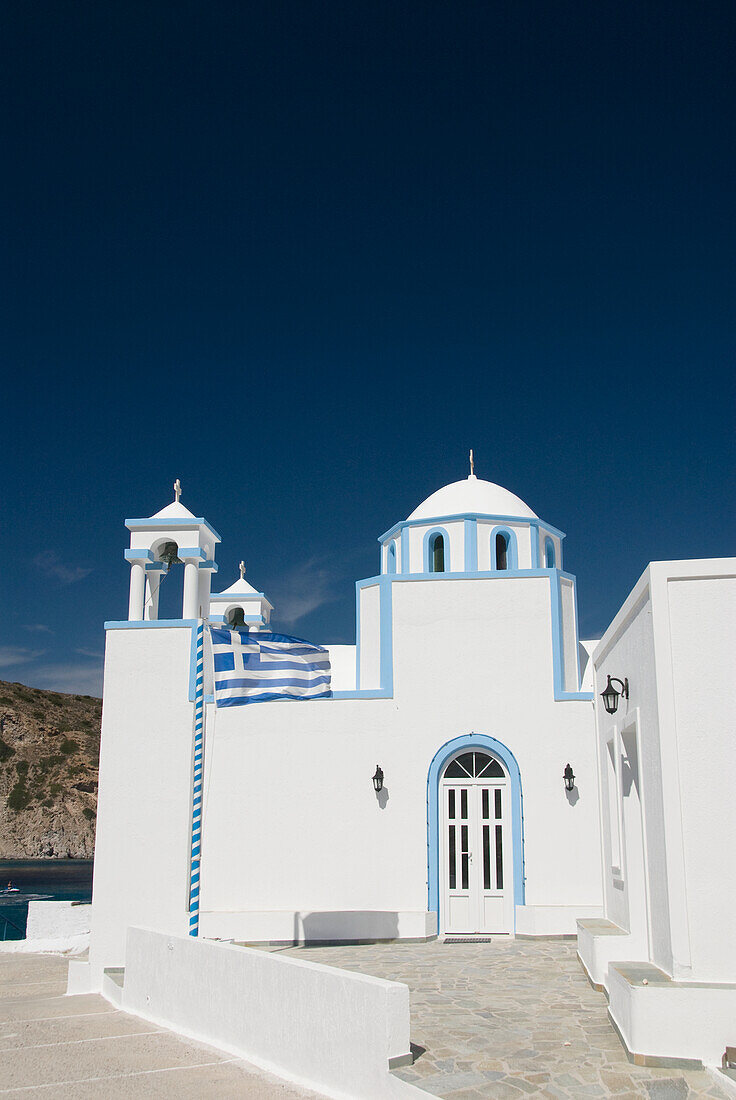 Greece, Cyclades, Island of Milos, Village of Firopotamos, Greek Orthodox Church near shore.