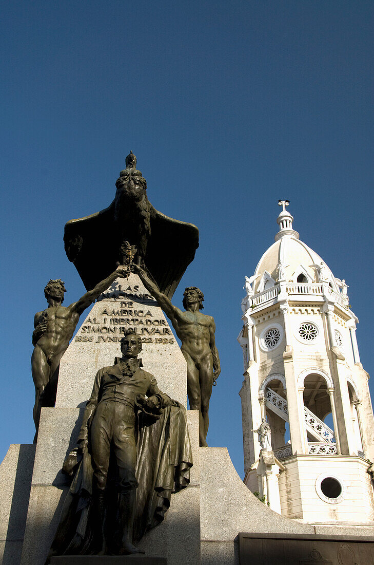 Panama, Panama City, Cosco Viejo, Plaza Bolivar, statue of Simon Bolivar (left), the bell tower of the church of San Francisco de Assis (right)