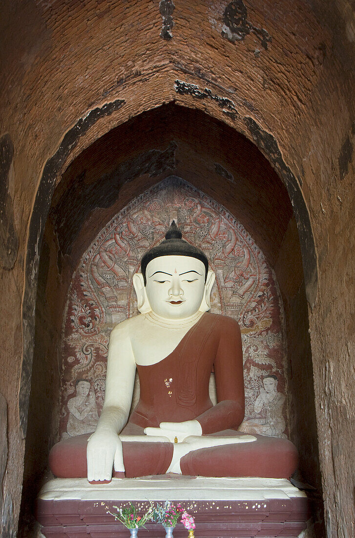 Myanmar, Bagan, Dhammayangyi Pahto, Sitting Buddha statue.