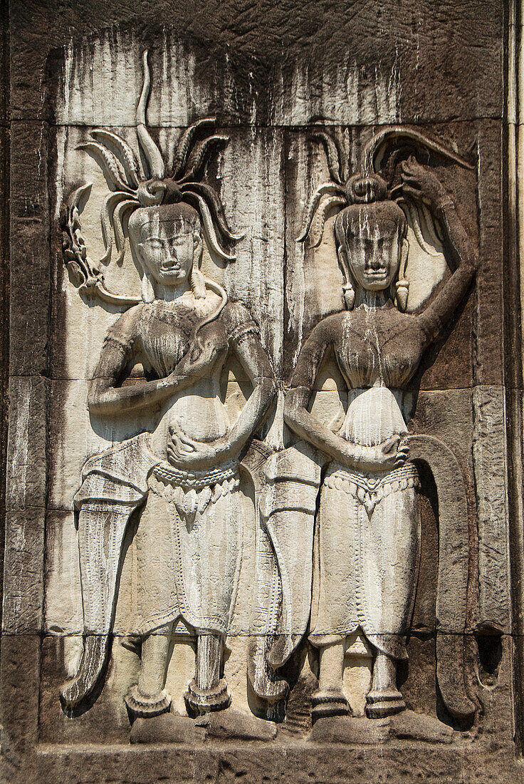 Cambodia, Siem Reap, Angkor Wat, Angkor Archaeological Park, Carvings in exterior of building.