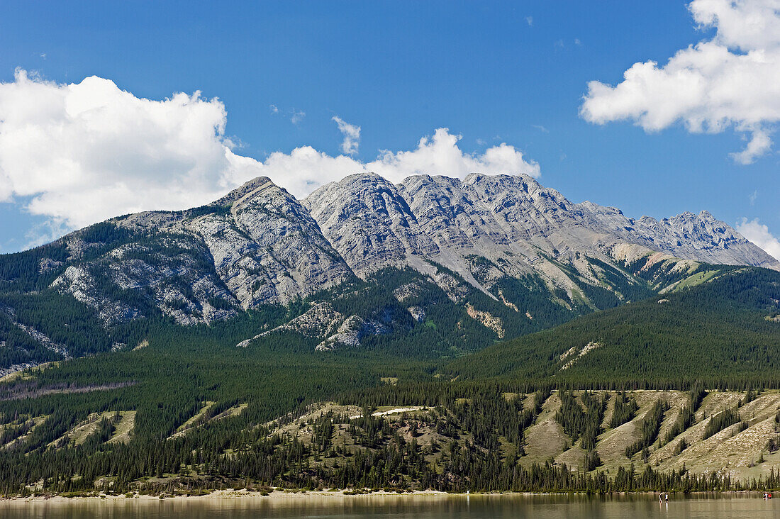 Shoreline Of A Lake And The Mountains; Alberta Canada