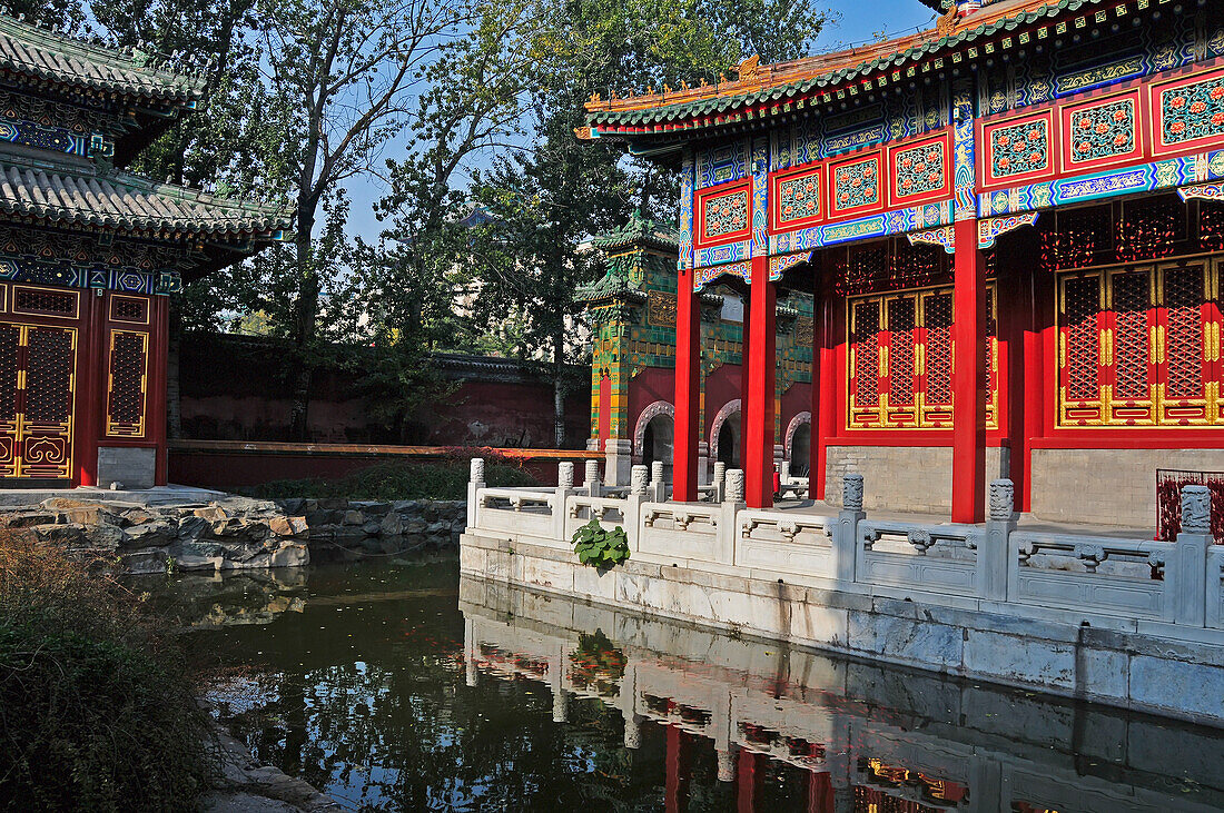 Colourful Ornate Buildings Along The Water's Edge; Beijing China