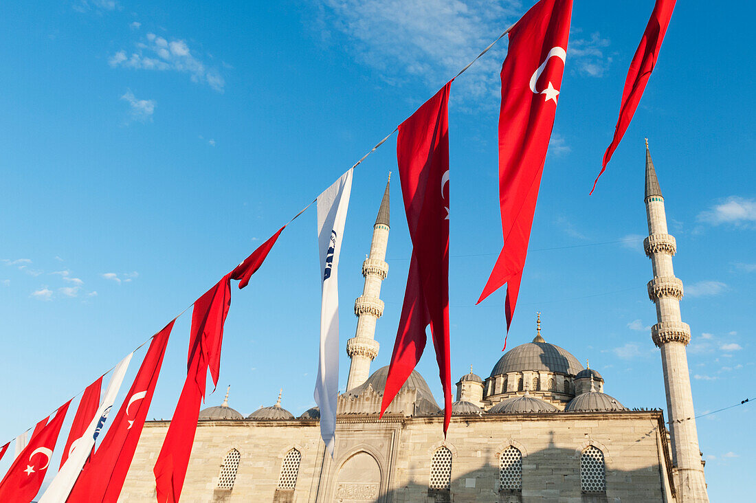 Flags Flying In Front Of The New Mosque; Istanbul Turkey