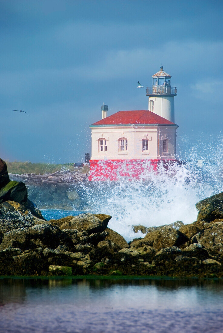 Oregon Lighthouse With Crashing Wave; Bandon Oregon United States Of America