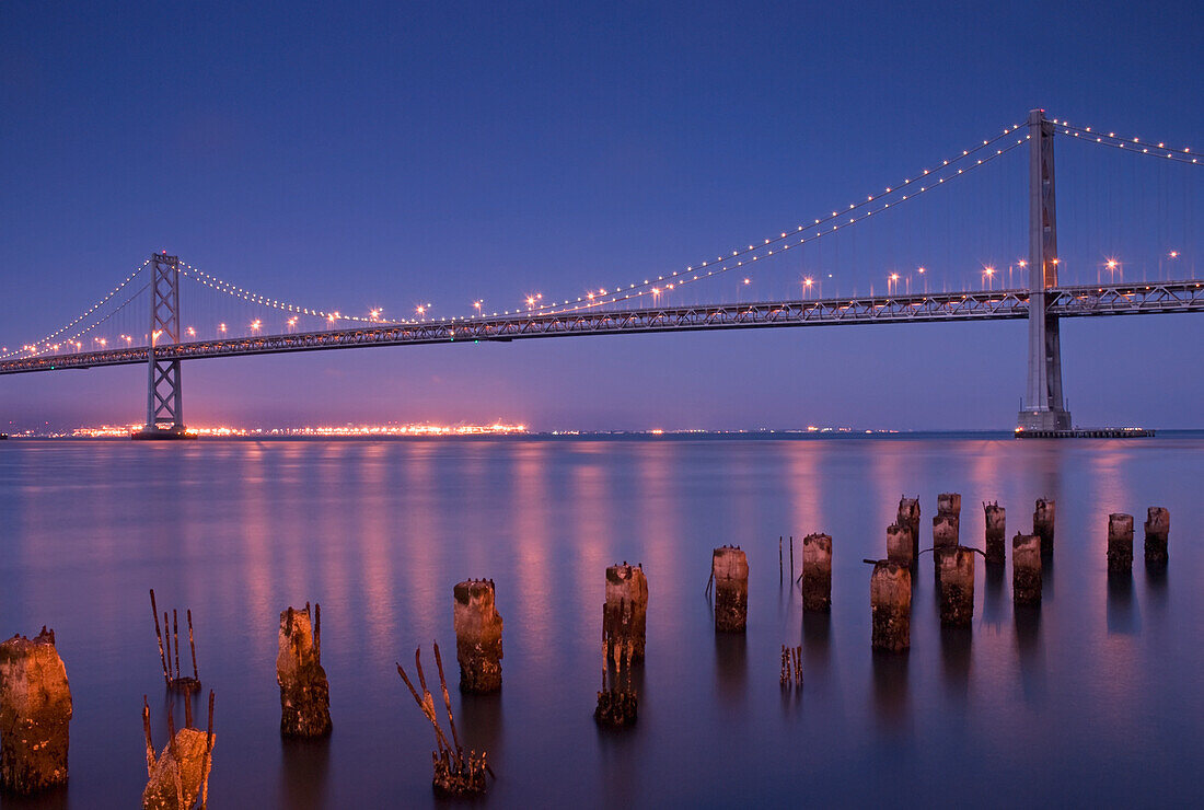 The San Francisco Bay Bridge At Night; San Francisco California United States Of America