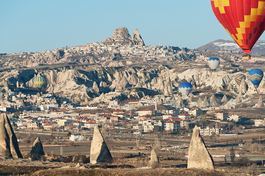 Hot Air Balloons In Flight Above The City; Goreme Nevsehir Turkey