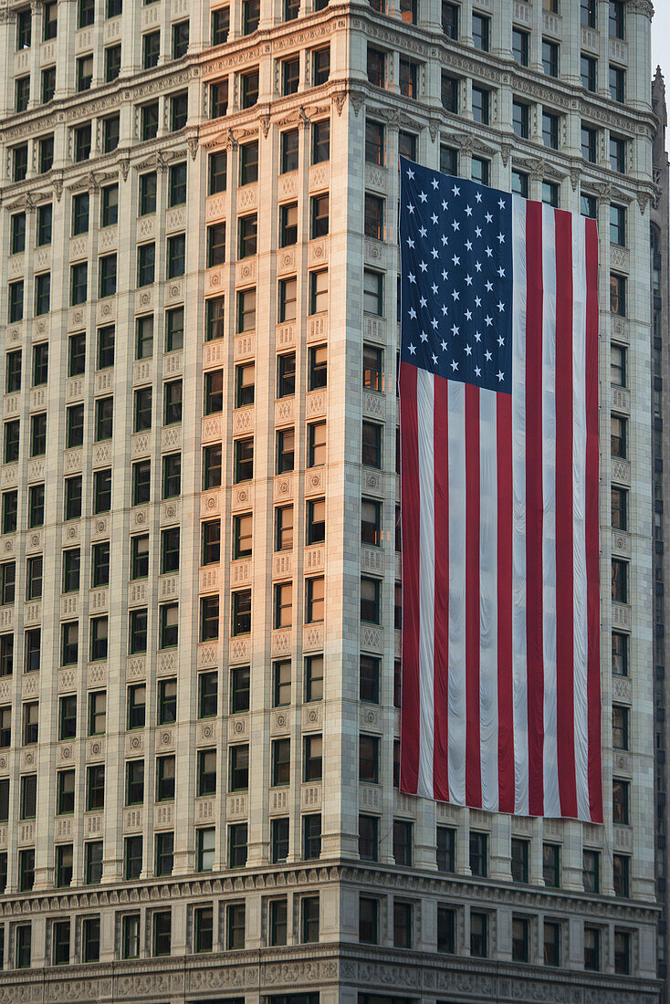 Large American Flag Hanging On The Side Of A Building; Chicago Illinois United States Of America
