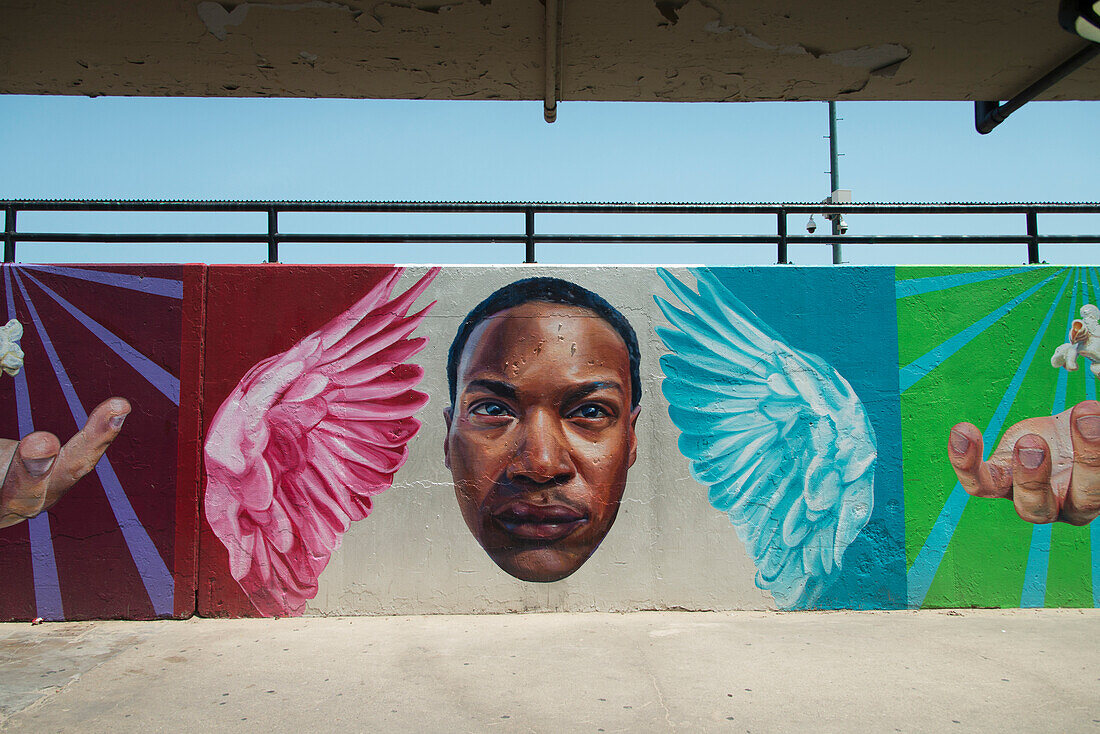 Picture Of A Face Hands And Angels On Colourful Murals On A Wall; Chicago Illinois United States Of America
