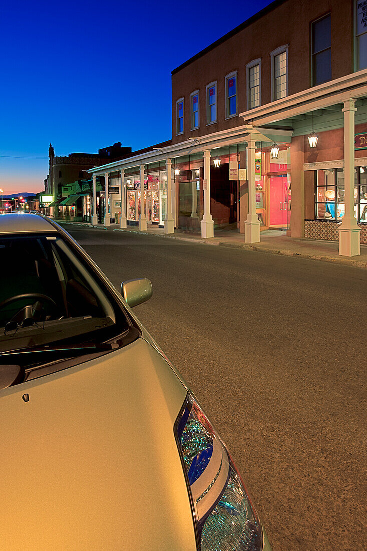 USA, New Mexico, Santa Fe, View along West San Francisco Street at dusk in downtown